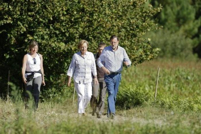 Merkel y Rajoy, de paseo por el Camino de Santiago
