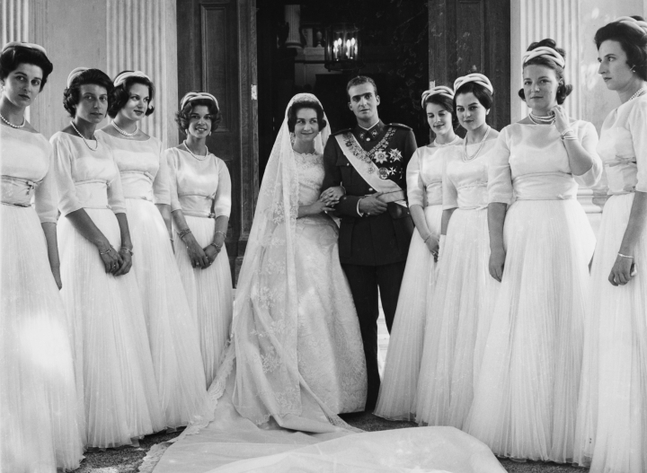 Greek Royal Princess Sophia of Greece and Denmark, wearing a wedding dress designed by Jean Desses, and Spanish Royal Juan Carlos, Prince of Asturias, in his Spanish Army uniform, pose with their bridesmaids (Princess Irene of Greece and Denmark, Infanta Pilar of Spain, Princess Anne-Marie of Denmark, Princess Benedikte of Denmark, Princess Irene of the Netherlands, Princess Alexandra of Kent, Princess Anne of Orleans, Princess Tatiana Radziwill) ahead of their wedding ceremonies, in Athens, Greece, 14th May 1962. The wedding saw the Royal couple attend three ceremonies - a Roman Catholic ceremony at Athens' Cathedral Basilica of St Dionysius the Areopagite, a Greek Orthodox ceremony at the Metropolitan Cathedral of the Annunciation, and a civil ceremony held upon their return to the Royal Palace in Athens. (Photo by Hellas Press Athens/Keystone/Hulton Archive/Getty Images)