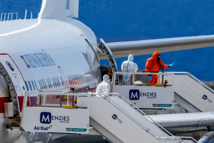 alt="alt="Passengers of the cruise ship MV Hondius, which was affected by a hantavirus outbreak, board a Spanish plane at Tenerife Sud airport, Canary Islands, Spain, May 10, 2026. REUTERS/Borja Suarez""