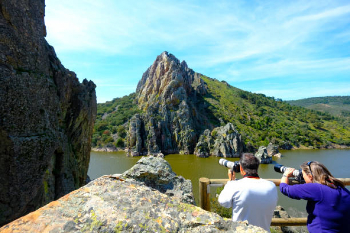 alt="alt="Monfrague National Park, Spain - April 16, 2018: Tourists observed the vulture protection zone known as Salto del Gitano in the Monfrague National Park in the province of Caceres in Extremadura Spain""