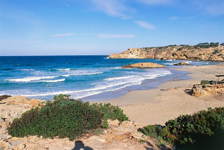 alt="alt="SPAIN - FEBRUARY 22: Beach and the rocky coast in Cala Tarida, Ibiza, Balearic islands, Spain. (Photo by DeAgostini/Getty Images)""