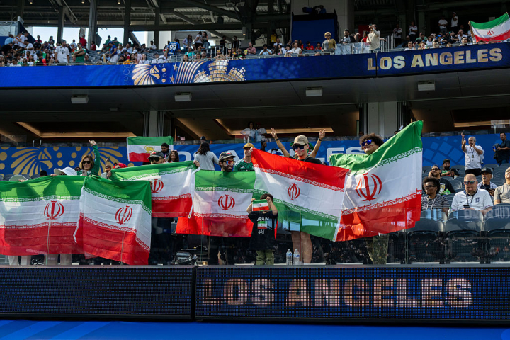 INGLEWOOD, CALIFORNIA - JUNE 15: Fans of Iran with flags of the Islamic Republic of Iran during the FIFA World Cup 2026 Group G match between IR Iran and New Zealand at Los Angeles Stadium on June 15, 2026 in Inglewood, United States. (Photo by Sebastian Frej/Getty Images)