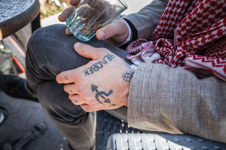 Communist tattoos are visible on Fergie Chambers' hands and fingers while he is in a cafe in Tunis, Tunisia, on February 8, 2024. James Cox Chambers Jr., born in 1985 and also known as Fergie Chambers, is an American political activist, philanthropist, and heir to the Cox family, who derives his wealth from Cox Enterprises. (Photo by Chedly Ben Ibrahim/NurPhoto via Getty Images)