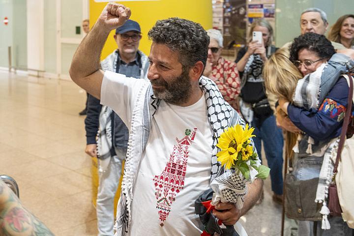 BARCELONA, SPAIN - MAY 10: Activist Saif Abukeshek returns to Barcelona-El Prat Airport after being released by Israel following his detention during the interception of the Global Sumud Flotilla in international waters, in Barcelona, Spain on May 10, 2026. Abukeshek, a Palestinian origin activist with Spanish and Swedish nationality, spent ten days in Shikma prison in Ashkelon after being detained on April 30 alongside Brazilian activist Thiago Avila. Abukeshek said he planned to travel to Turkiye in the coming days to rejoin other flotilla activists preparing further initiatives. (Photo by Lorena Sopena Lopez/Anadolu via Getty Images)