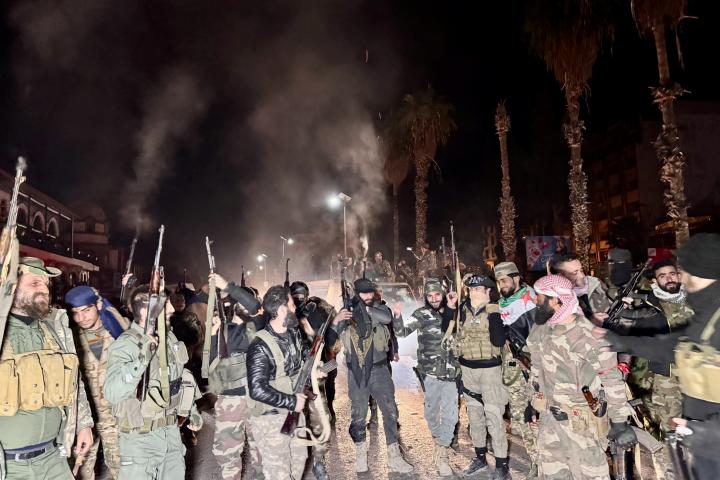 Rebeldes de Siria tras entrar en Damasco.