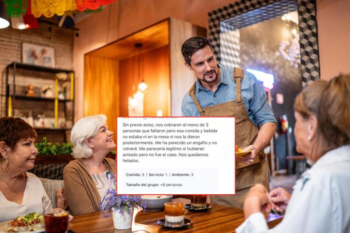 Un camarero atendiendo a unos clientes en el restaurante.