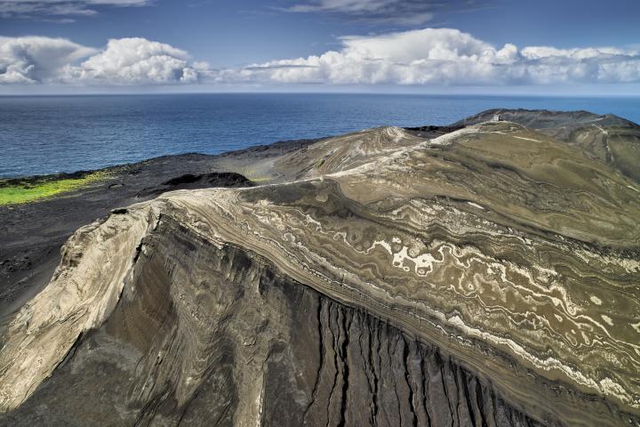 alt="alt="Surtsey Island, off the south coast of Southern Iceland, was created by undersea volcanic eruptions in 1963. The island has been preserved as a living laboratory since 1964, allowing scientists the chance to study how new land masses are colonized by species without the interference of man. The island's population has grown to many species of plants and bird life.""