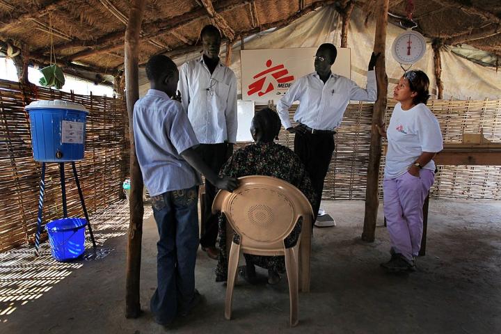 SOUTHERN SUDAN:  (AUSTRALIA OUT) Medecins Sans Frontieres, South Sudan. Australian Sudanese man, Mayath Wak, translates a conversation between Medecins Sans Frontieres medical staff and patients at the MSF out-patient department in Abyei. He has returned to South Sudan to work as a translator for MSF and make sure his family is safe during the referendum period. (Photo by Kate Geraghty/Sydney Morning Herald/Getty Images)