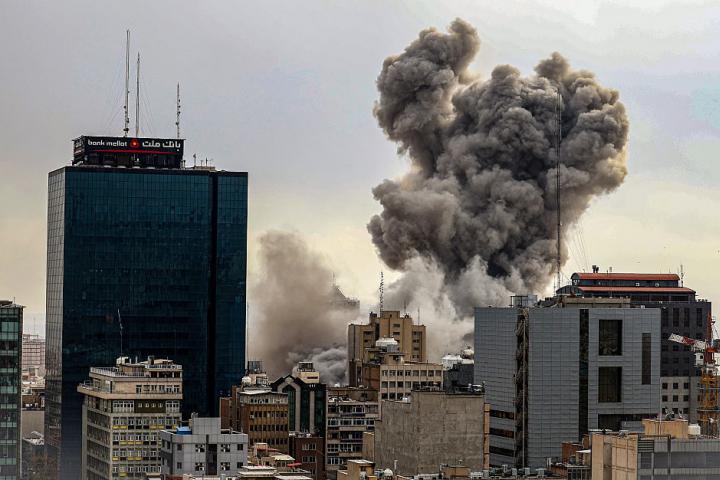 TEHRAN, IRAN - MARCH 02: A general view of Tehran with smoke visible in the distance after explosions were reported in the city, on March 02, 2026 in Tehran, Iran. (Photo by Contributor/Getty Images)