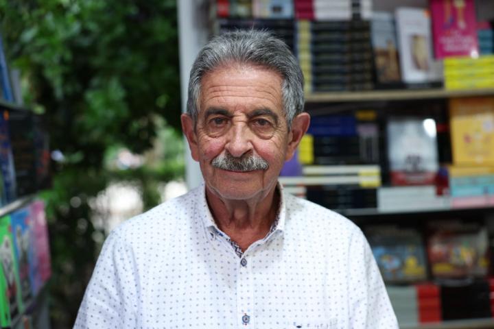 MADRID, SPAIN - JUNE 03: The acting president of Cantabria, Miguel Angel Revilla, signs at the 82nd Madrid Book Fair, at the Retiro Park, on June 3, 2023, in Madrid, Spain. The Book Fair is held annually to promote books, reading and the activities of companies, entities and institutions that publish, distribute or sell books to the public. Dozens of authors are attending the 82nd edition of the Book Fair, which is held under the slogan 'We are of Science and Letters', with a total of 36 booths lined up plus the 24 in the central area of the route and will be open until June 11. (Photo By Isabel Infantes/Europa Press via Getty Images)