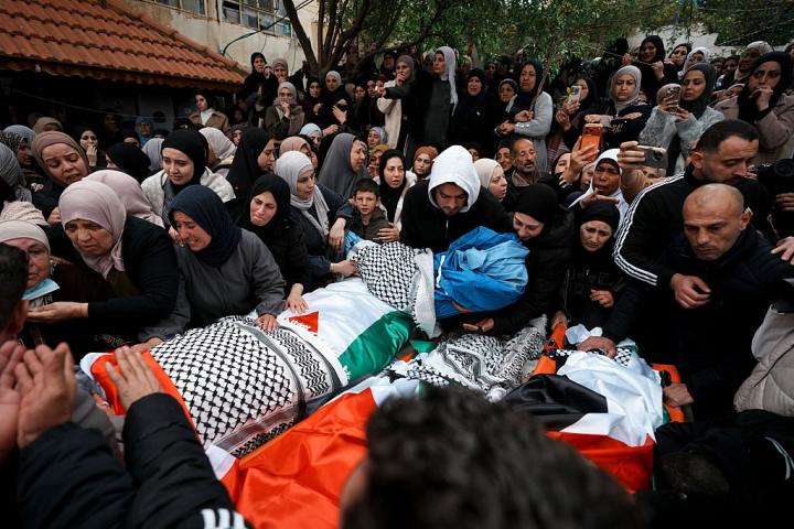 TUBAS, WEST BANK - MARCH 15: People attend the funeral ceremony of Palestinian mother, father, and two children who lost their life as a result of Israeli forces' opening fire at the village of Tamun, near the city of Tubas, West Bank on March 15, 2026. (Photo by Issam Rimawi/Anadolu via Getty Images)