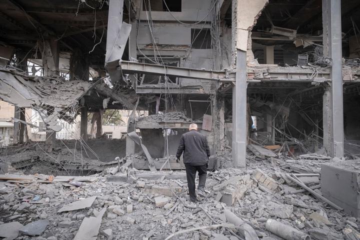 A man walks among the ruins of a commercial-office building affected during military operations in a residential area of Tehran, Iran, on March 29, 2026. (Photo by Morteza Nikoubazl/NurPhoto via Getty Images)