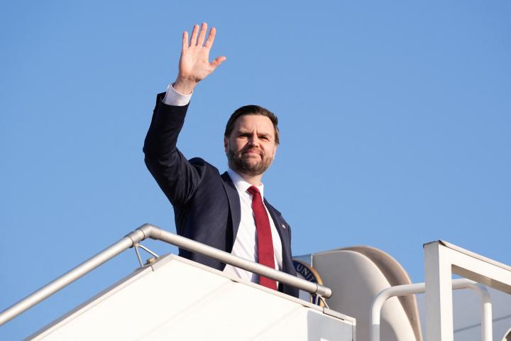 U.S. Vice President JD Vance waves as he boards Air Force Two, after peace talks with Iran in Islamabad, Pakistan, Sunday, April 12, 2026. Jacquelyn Martin/Pool via REUTERS