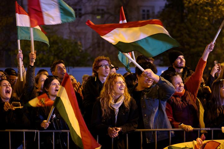 BUDAPEST, HUNGARY - APRIL 12: Supporters of the Tisza party react to the election result, which puts Peter Magyar, lead candidate of the opposition party, at the lead during Hungarian parliamentary elections on April 12, 2026 in Budapest, Hungary. Prime Minister Viktor Orban of the Fidesz party has conceded his party's election loss, paving the way for Peter Magyar, lead candidate of the Tisza party, to become the next prime minister. (Photo by Janos Kummer/Getty Images)