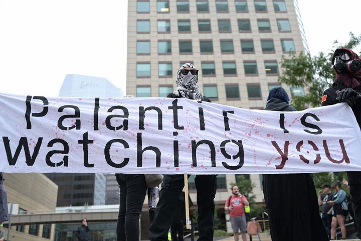 DENVER, CO - AUGUST 22 :  Protesters held a rally against Big Tech, Palantir, and Governor Jared Polis's support of a bill that could undermine AI consumer protections in front of Palantir Headquarters in Denver, Colorado on Friday, August 22, 2025. (Photo by Hyoung Chang/The Denver Post)