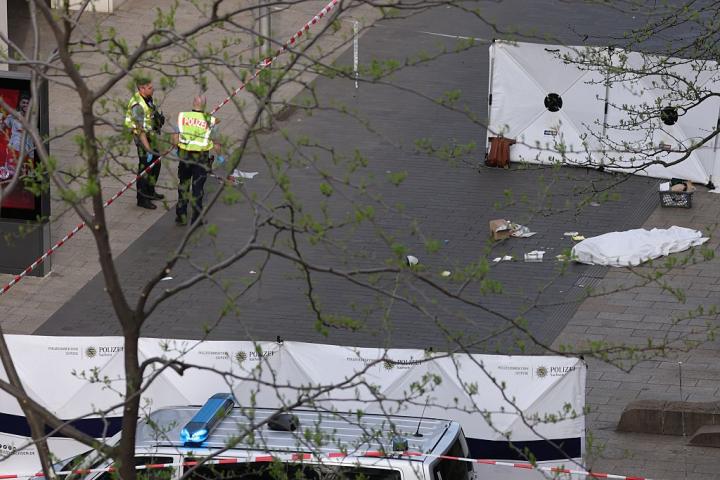 04 May 2026, Saxony, Leipzig: Police officers stand next to a body bag containing a corpse at the spot where a car drove into a group of people. Photo: Jan Woitas/dpa (Photo by Jan Woitas/picture alliance via Getty Images)