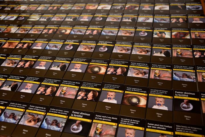 FRANCE - 2021/12/14: In this photo illustration, packs of cigarettes with images depicting the negative effects of smoking are seen displayed.
In order to fight against smoking, the government of French territory, New Caledonia, has proposed in a draft proposal to increase the price of all tobacco products by 10% per year, over three years, from January 1, 2022. (Photo Illustration by Gerard Bottino/SOPA Images/LightRocket via Getty Images)