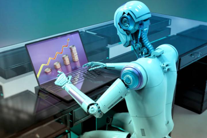 Humanoid robot working on laptop studying financial chart, conceptual computer illustration