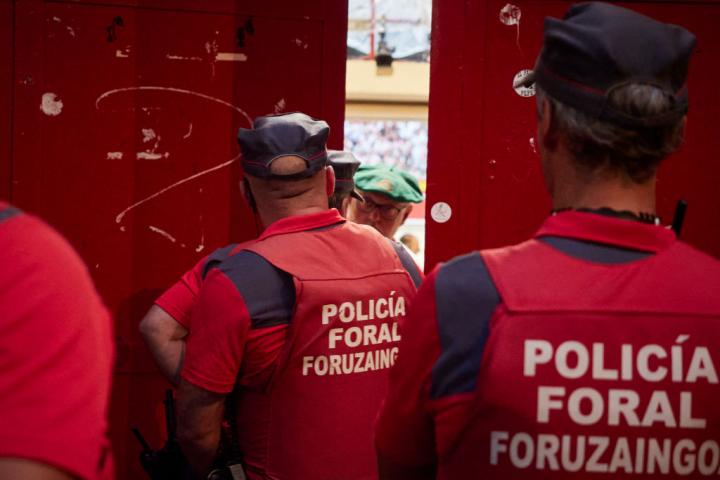 PAMPLONA NAVARRA, SPAIN - JULY 13: Foral police watch the bullring minutes before the seventh and penultimate running of the bulls of the San Fermin 2022 fiestas of the Don Victoriano del Rio Cortes ranch on July 13, 2022, in Pamplona, Navarra, Spain. The festivities in honor of San Fermin, patron saint of Navarre, begin on July 6 with the traditional chupinazo and continue until July 14 with the chanting of 'Pobre de mi' (Poor me). During its course there are a total of eight running of the bulls that begin every day at eight o'clock in the morning. In addition, the City Council has prepared a repertoire of concerts, open-air dances, fireworks, exhibitions, street entertainment and activities for citizens and visitors. This festival, which attracts millions of visitors every year for its festive atmosphere and its popular running of the bulls, has been declared of International Tourist Interest. (Photo By Eduardo Sanz/Europa Press via Getty Images)