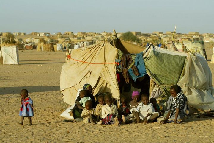 Thousands of Sudanese refugees have gathered in the Médecins Sans Frontières camp, fleeing conflicts in the Darfour region. They have built makeshift shelters. Nights here are very cold. | Location: TINE, Chad. (Photo by Patrick ROBERT/Corbis via Getty Images)