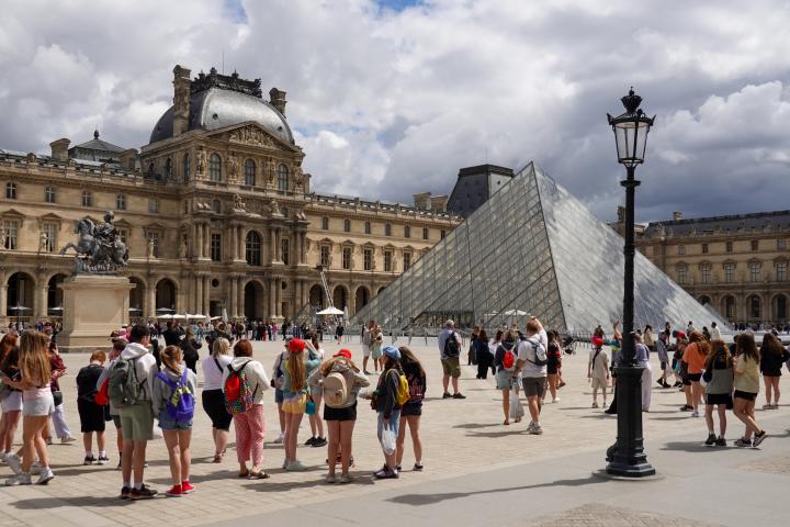 alt="alt="Visitors gather in the Cour Napoleon in front of the Louvre Pyramid at the Louvre Museum in Paris, France, on June 9, 2026. The glass pyramid serves as the museum's main entrance and is one of the city's most visited cultural landmarks. (Photo by Michael Nguyen/NurPhoto via Getty Images)""