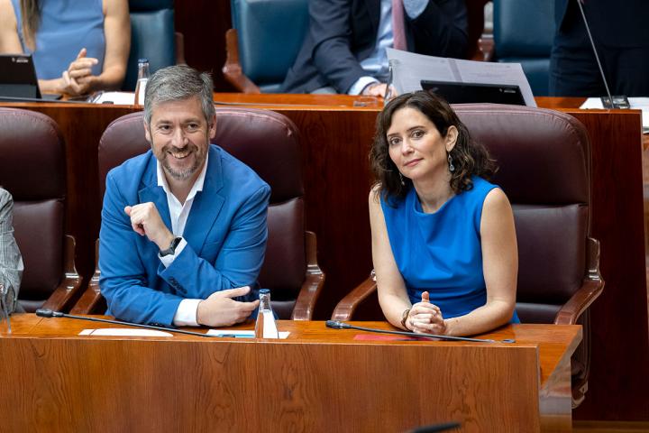 SPAIN - JUNE 11: The Regional Minister of the Presidency, Justice and Local Administration, and spokesperson for the regional government, Miguel Angel Garcia Martin, and the President of the Community of Madrid, Isabel Diaz Ayuso, during a plenary session of the Assembly of Madrid, on 11 June, 2026 in Madrid, Spain. The Assembly of Madrid approves the reform of the Rules of Procedure of the Chamber to introduce the legislative footprint and regulatory traceability, in a session that still echoes the recent visit of Pope Leo XIV to the region. (Photo By Alberto Ortega/Europa Press via Getty Images)