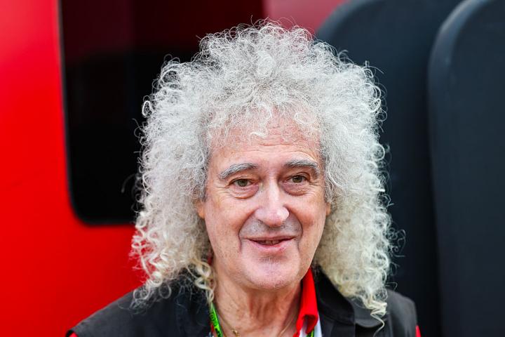 NORTHAMPTON, ENGLAND - JULY 5: Sir Brian May walks in the paddock during the F1 Grand Prix of Great Britain at Silverstone Circuit on July 5, 2026 in Northampton, United Kingdom. (Photo by Kym Illman/Getty Images)