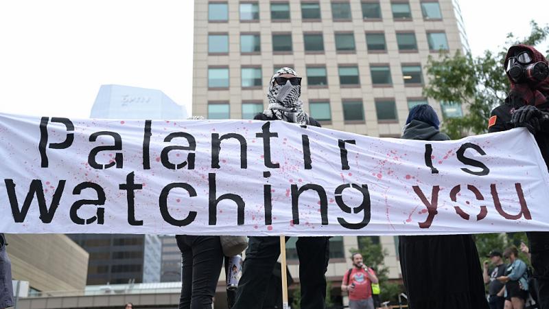 DENVER, CO - AUGUST 22 :  Protesters held a rally against Big Tech, Palantir, and Governor Jared Polis's support of a bill that could undermine AI consumer protections in front of Palantir Headquarters in Denver, Colorado on Friday, August 22, 2025. (Photo by Hyoung Chang/The Denver Post)