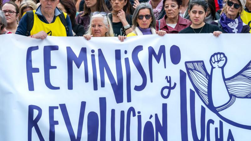 Protesters hold a banner saying ''feminism, revolution and struggle'' during the International Women's Day demonstration in Santander, Spain. (Photo by Celestino Arce/NurPhoto via Getty Images)