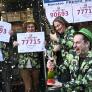 Empleados de la administración de lotería de Oviedo en la que no solo han vendido décimos del 90693, el tercer premio; también del 77715, uno de los quintos premios, durante el Sorteo Extraordinario de la Lotería de Navidad.
